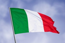 Italy flag isolated on sky background. close up waving flag of Italy. flag symbols of Italy.
