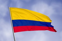 Colombia flag isolated on sky background. close up waving flag of Colombia. flag symbols of Colombia.