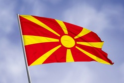 Macedonia flag isolated on sky background. close up waving flag of Macedonia. flag symbols of Macedonia.