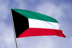 Kuwait flag isolated on sky background. close up waving flag of Kuwait. flag symbols of Kuwait.