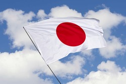 Japan flag isolated on sky background with clipping path. close up waving flag of Japan. flag symbols of Japan.