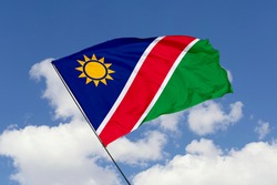 Namibia flag isolated on sky background with clipping path. close up waving flag of Namibia. flag symbols of Namibia.
