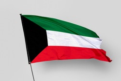 Kuwait flag isolated on white background. National symbol of Kuwait. Close up waving flag with clipping path.