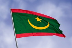 
Mauritania flag isolated on sky background. Close up waving flag of Mauritania. Concept of Mauritanian.