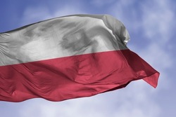 Poland flag isolated on the blue sky with clipping path. close up waving flag of Poland. flag symbols of Polish.