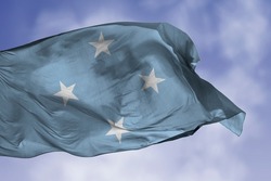 Micronesia flag isolated on the blue sky with clipping path. close up waving flag of Micronesia. flag symbols of Micronesian.