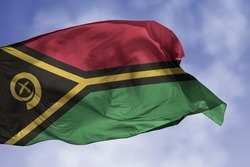 Vanuatu flag isolated on the blue sky with clipping path. close up waving flag of Vanuatu. flag symbols of Vanuatuan.