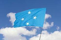 Micronesia flag is isolated on the blue sky with a clipping path. flag symbols of Micronesia.