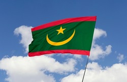 Mauritania flag is isolated on the blue sky with a clipping path. flag symbols of Mauritania.
