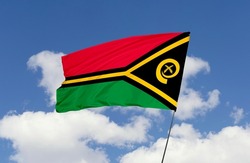 Vanuatu flag is isolated on the blue sky with a clipping path. flag symbols of Vanuatu.