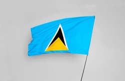The Saint Lucia flag is isolated on a white background with a clipping path. flag symbols of Saint Lucia. flag frame with empty space for your text.