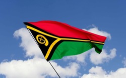 Vanuatu flag isolated on the blue sky with clipping path.