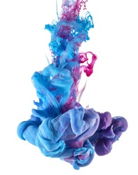Color drop underwater creating a silk drapery. Ink swirling underwater.  Cloud of colorful shiny ink isolated on black background. Blue and magenta mix into violet.