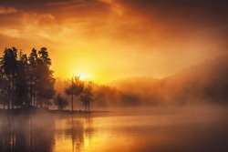 Morning fog on the lake, sunrise shot.