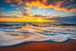 Beach sunrise  or sunset over the tropical sea and sky with clouds