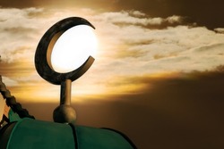 Crescent against sun and evening sky. Symbol of Islam and Ramadan. Symbol islamic religion. Muslim background with copy space
