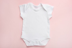 Layout Flat Lay white baby shirt bodysuit, on a pink background, for girls. Mock up for design and placement of logos, advertisements