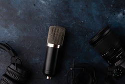 Microphone for recording the voice isolated on dark blue background. Music concept.
