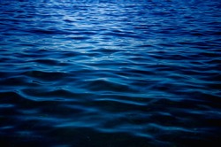Sea abstract background dark blue surface of water