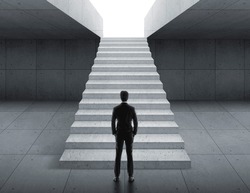 Businessman looking at stairs. business start concept