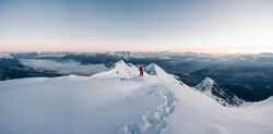 Panoramic banner of man trekking in snow covered mountain. Sport  concept. Silhouette trail hiker in mountain summit background. Hiker on the or alpiniston run training outdoors active fit lifestyle.