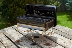 compact portable charcoal grill outdoors