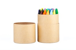 Colorful thin wax crayons set in an open eco friendly brown paper tube packaging, simple crayon paper box object isolated on white, cut out. School supplies, drawing accessories, education, creativity
