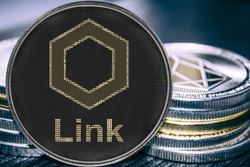Coin cryptocurrency chainlink liink on the background of a stack of coins.