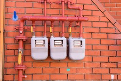 Residential natural gas meter installed on a wall  at Gamcheon Cultural Village in Busan, South Korea.