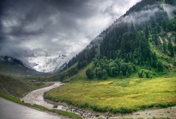 storm clouds over mountains of ladakh, green valley sccenary,  Jammu and Kashmir, India