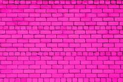 Magenta colored brick background. Brick wall. 
