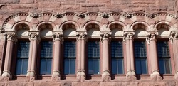 Pattern of Arched windows of ancient Romanesque revival architecture