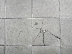 Cracked Pathway, close up Cement floors, top view  cracked tile