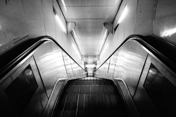 An escalator in Paris Metro, in black and white 