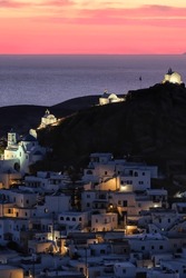 Beautiful sunset and panoramic view of the picturesque and whitewashed island of Ios Greece