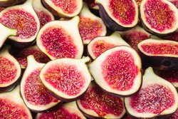Tasty figs background. Top view. Slices.  