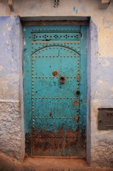 beautiful background and texture green-blue door at sidewalk, old town, Morocco