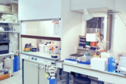 Scientific background: blurred interior of modern cell culture room in modern laboratory. This is defocused background image, no focus point here. Ideal as a presentation background.