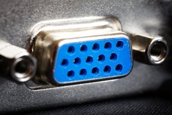 The blue VGA port of a modern video card, used to transfer images from a computer to a monitor or projector. Macro. Shallow depth of field. Selective focusing. Close-up