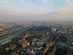 Aerial view of City Life Milan skyline from and glass skyscrapers in Milano. Birds eye of modern architecture of office buildings in new city districts. Drone Milano and Lombardia.