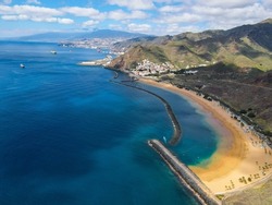Aerial view of Playa de Las Teresitas (Las Teresitas beach). White and yellow sand beach with scenic San Andres village in Tenerife, Canary Islands, Spain. Near Santa Cruz de Tenerife, from Mirador.