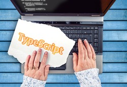 TypeScript Programming Language. Word TypeScript on paper and laptop 
