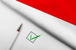 Pencil, Flag of Indonesia and check mark on paper sheet 