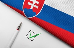 Pencil, Flag of Slovakia and check mark on paper sheet 