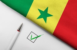 Pencil, Flag of Senegal and check mark on paper sheet 