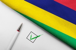  Pencil, Flag of Mauritius and check mark on paper sheet
