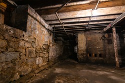 Interior of old grungy warehouse basement.