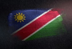 Namibia Flag Made of Metallic Brush Paint on Grunge Dark Wall