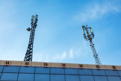Antenna for wireless communication. Cellular systems in the city. The cell tower with 3G, 4G and 5G communications. Base station for operating mobile phones, receiving and sending a signal.