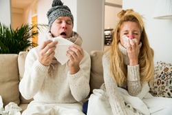 Sick couple catch cold. Man and woman sneezing, coughing. People got flu, having runny nose.
